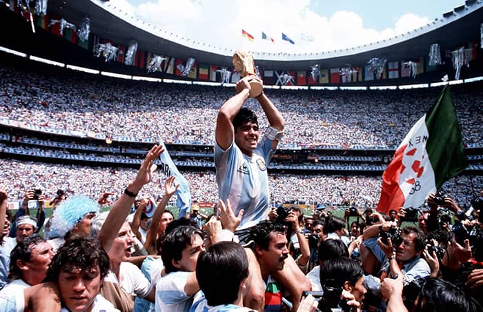 1986, World Cup Final, (Mexico City). Argentina Captain, Diego Maradona holds the World Cup trophy whilst being carried on his team-mates' shoulders