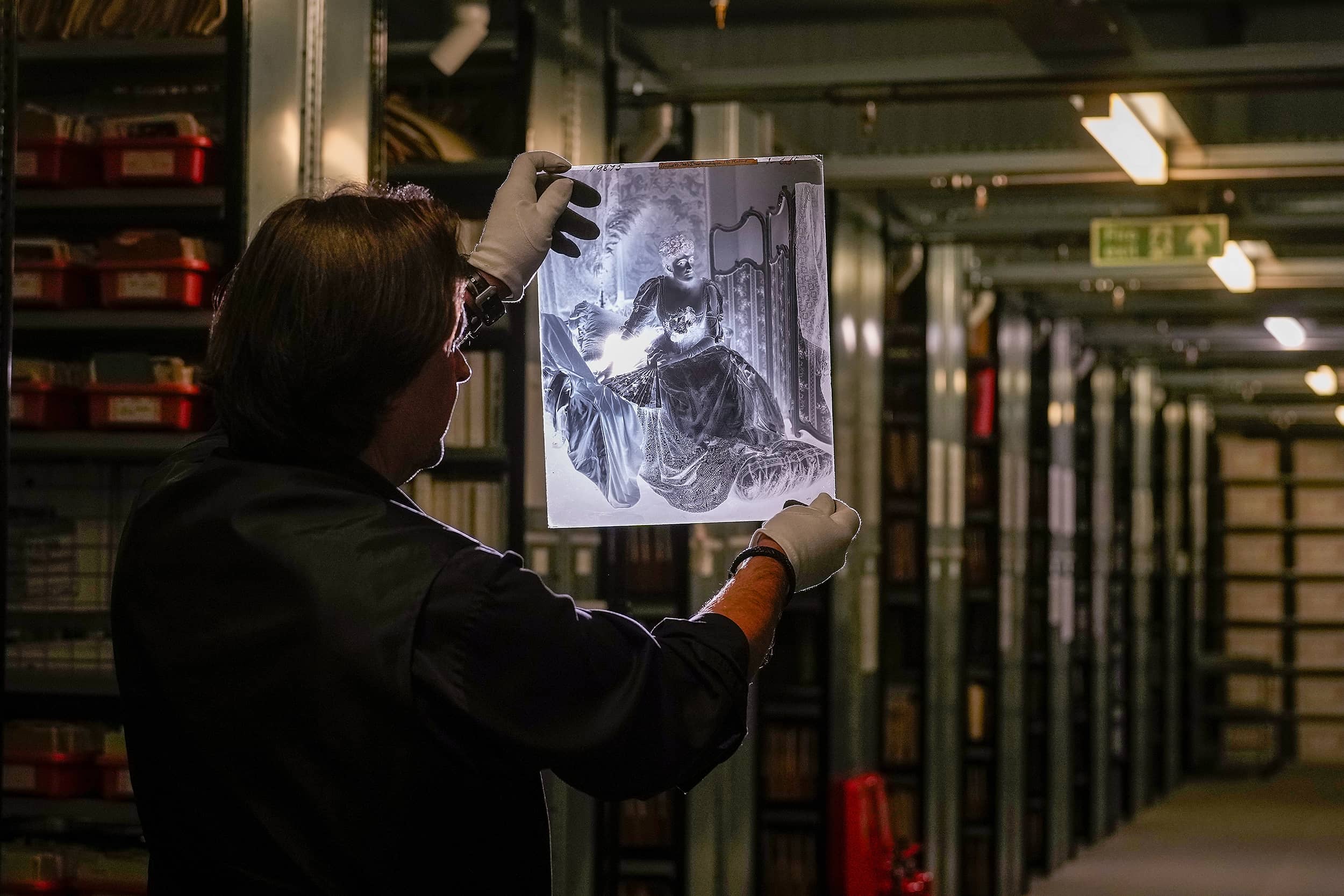 Matt Butson, VP Hulton Archive, holding a 18 inch x 14 inch glass plate negative from the London Stereoscopic Company at the Getty Images Hulton Archive, London E16, 12th September 2023